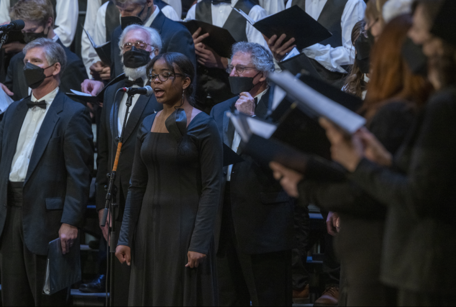 IN HARMONY. Sophomore Millicent Benson sings her solo in Cornerstone, a piece set to biblical verses sung by student choirs and Community Chorale. I usually feel pretty nervous on stage, but I feel better when I start singing, Benson said.