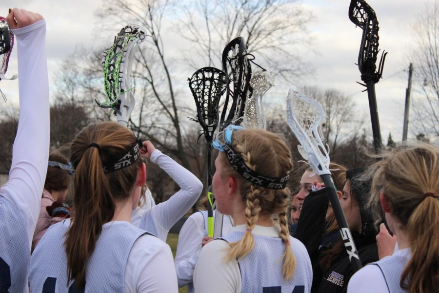 SPARTANS ON THREE. After a post-game pep talk, the Spartans finish off with their cheer.