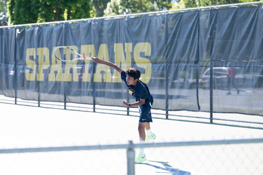 Sophomore Baasit Mahmood serves the ball to an opponent in a very close match.