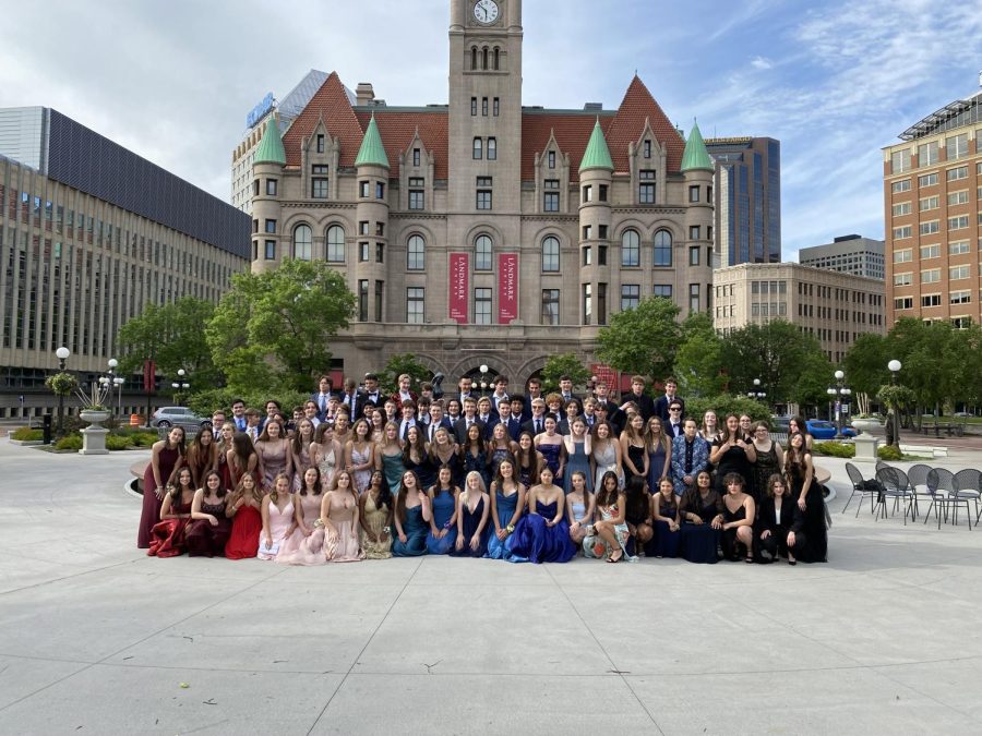 DRESSED TO THE NINES. Juniors and seniors wear their most elegant gowns and suits for prom in the spring, like the seniors pictured here from 2021. There are many other great ways to find these dazzling outfits besides purchasing, such as thrifting or renting from organizations like Pass Down the Gown.