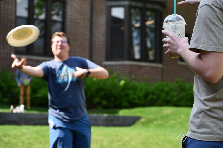 SWOOSH. Sophomore Andrew Drake quickly passes his frisbee to sophomore Theo Bonin.