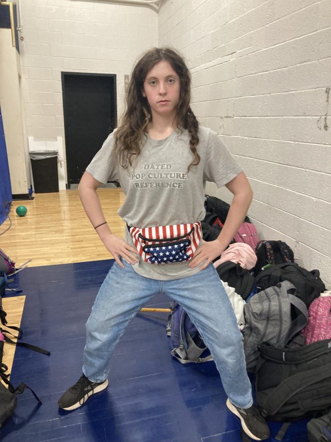 GRILL DAD. Junior Clare Kimmel dresses up using her fathering clothing for the middle age theme. "I went into my dads closet and found this shirts, and I found this fanny pack in the back of my closet."