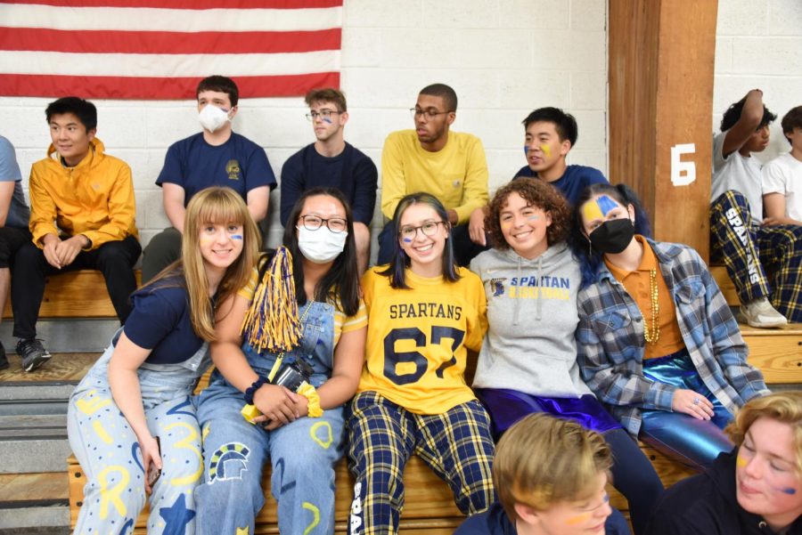 SENIOR SPIRIT. A group of seniors waits in anticipation for the start of the Pep Fest. Decked out in blue and gold, the senior class was one of the best-dressed grades for Homecoming this year.