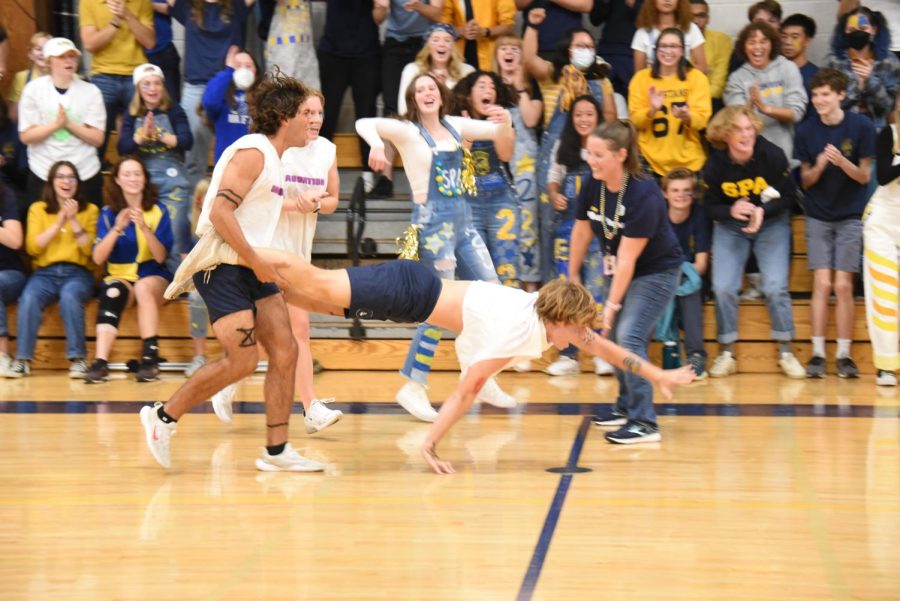 TO THE END. Seniors George Peltier and Nathan Cohen cross the finish line first to win the grade-level challenge. 