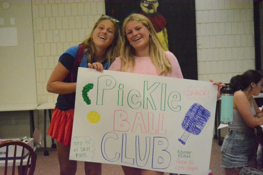 During Thursday x-period club leaders Anna and Leni Nowakowski finish their poster for the club fair. 