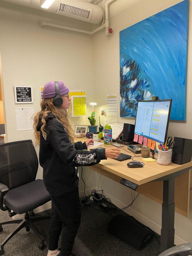 ROCKIN IT. US Assistant Claire Rohweder dresses like a teenager with her beanie and headphones.