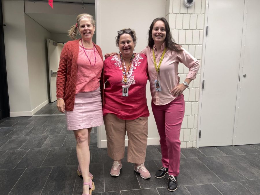 ON MONDAYS WE WEAR PINK: History teachers Nan Dreher and Mollie Ward, stand with science teacher Rachel Yost-Dubrow went all out, wearing head-to-toe pink outfits. Think pink! Dreher said.