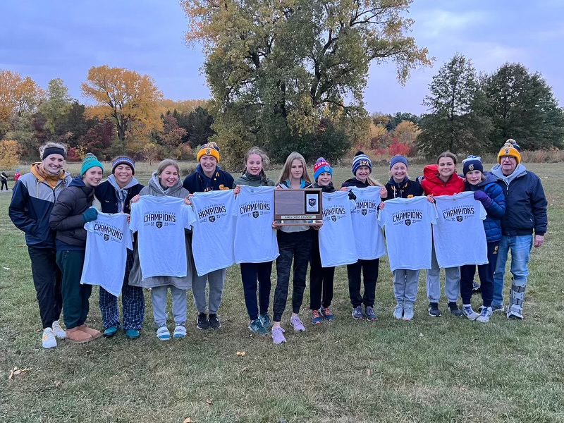 CONFERENCE CHAMPS. The Spartans gave it their all at the conference meet to beat rival Blake by one point, earning them the title of conference champs.