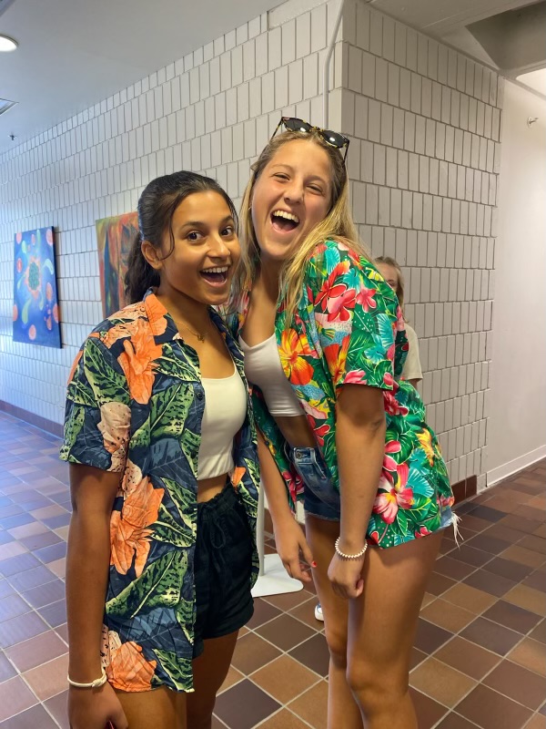 TEAM SPIRIT. Tennis players Audrey Senaratna and Anna Nowakowski show team spirit by dressing up in tropical button-down on the day of their match. 