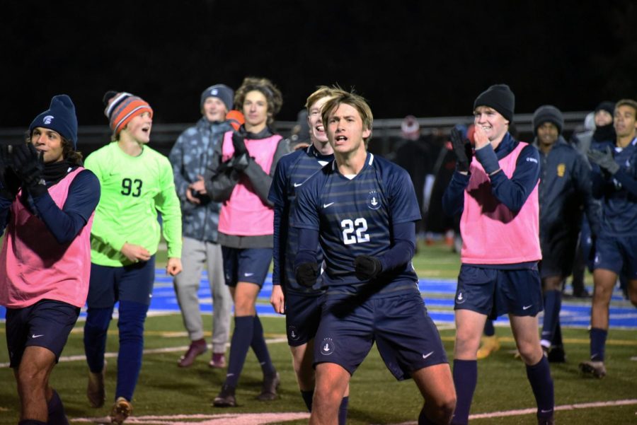 LETS GO. Followed by his teammates, captain Cooper Bollinger Danielson lets out celebratory cheers and runs towards the crowd after the end of the game.