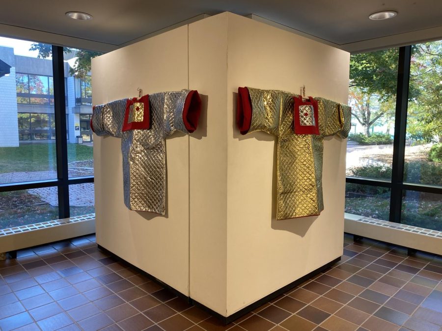 CULTURAL CLOTHING CELEBRATION. Koua Mai Yang’s art, focused on the clothing of her Hmong heritage, is on display in Drake gallery. “These bits of pieces of history have greatly influenced by practice” said Yang.