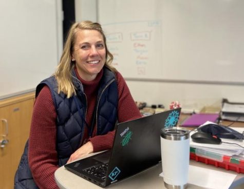 DECADES LATER. Piehl sits next to her working desk in the biology room recalling her high school days. 