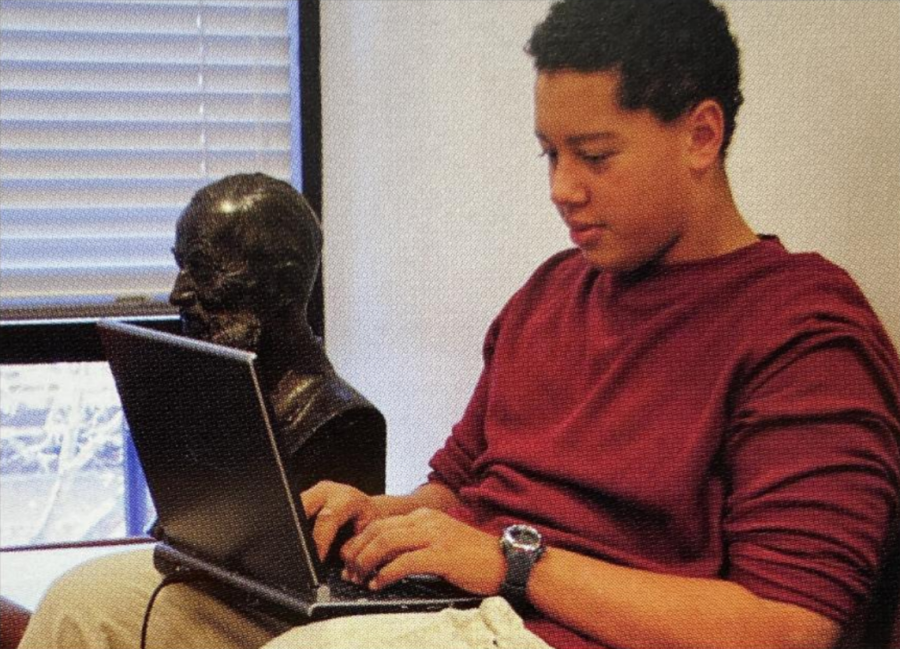 COMPUTER CULTURE. A student from 2012 types on his computer in the library. Back then, instead of the Lenovo ThinkPads in use today, students used the Toshiba Portege. 