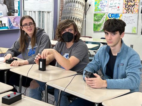 RAT RACE. Quiz Bowl players Emma Goodman, Cassie Zirps, and Colin Will compete at the Chaska tournament Saturday. Their third place finish qualified them for nationals in Atlanta this spring.