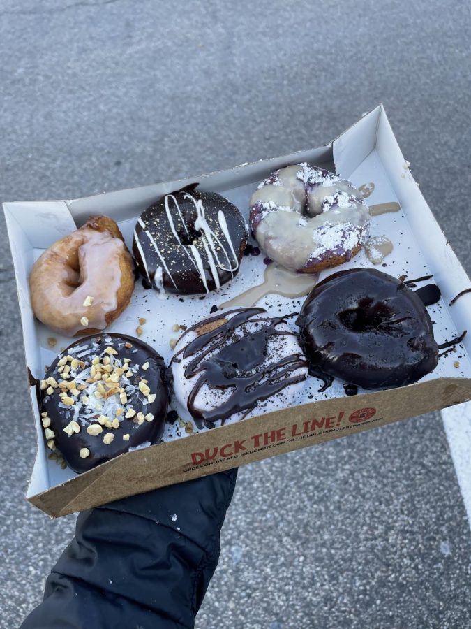 SWEET TREATS. Icing melts off Duck and Donuts freshly made desserts.