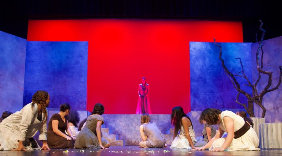 BURN DOWN THE HOUSE. Hecuba (Alison Mitchell) delivers her final monologue amidst the ruins of the burning city. The other Trojan women lie in defeat, her only audience. She uttered the final line of grief "The war begins, for me"  (smugmug)