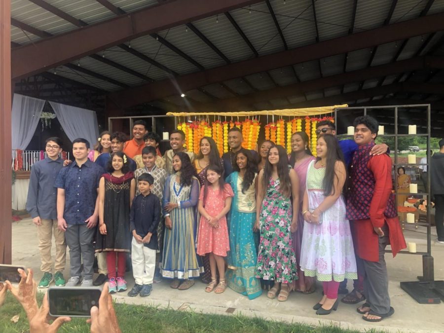 FULL TURN OUT. Melina Kannankutty poses for a group photo with other wedding guests. The group represents only a small number of the over 400 guests in attendance. "The thing that stood out to me was how many people were at the wedding," she said.