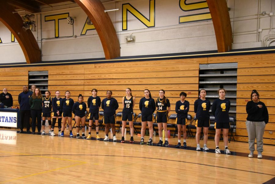 The Spartans standing for the national anthem pre-game.