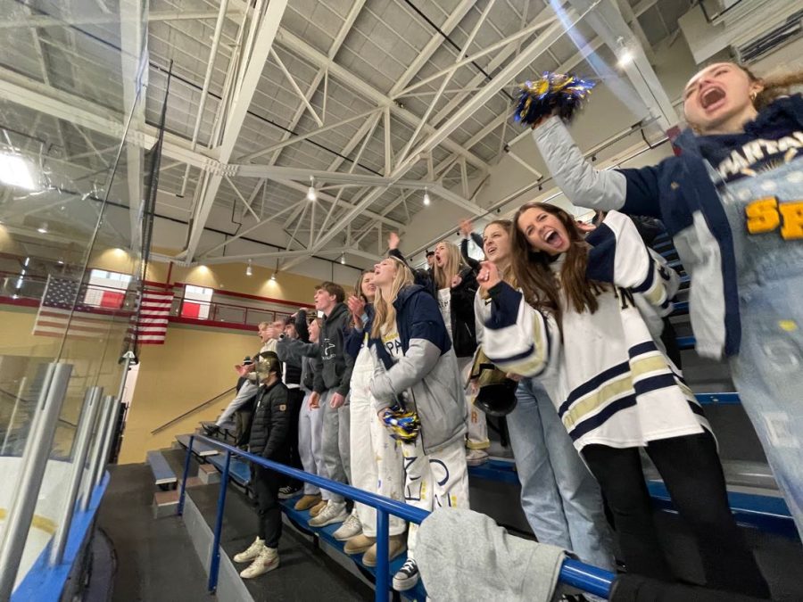 LETS GO SPARTANS. Students gather to cheer on the SPA boys hockey team as they face off against Highland Park in the first round of the section tournament. The Spartans went on to win the game 5-2.