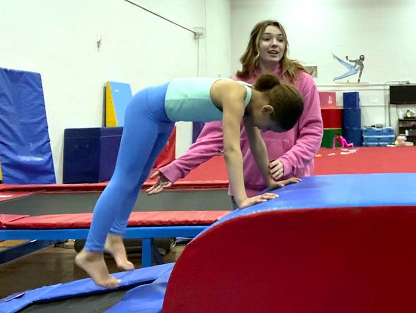 TUMBLE TIME. Elena Sjaastad teaches youth gymnastics through Community Education in Saint Paul Public Schools at Central High School. Her previous coach set her up with the job. She said, “My coach reached out and asked if I want to help coach little kids and I was like yeah of course that would be really fun.”