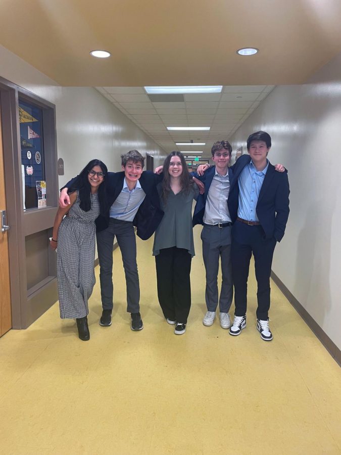 COMPETITION PREP. Cerena Karmaliani, Henry Hilton, Maya Sachs, David Schumacher, and Henry Choi celebrate at the Districts Qualifier tournament in December. SPA Debate earned the top two of three spots for Nationals, which will take place in June in Phoenix, AZ. 
