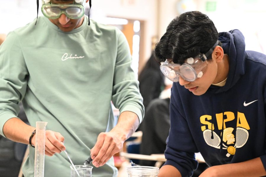 LASER FOCUS. Juniors Rishi Bhargava and Baasit Mahmood work together to finish their project efficiently. “With the right prep work, everyone’s events can have strong finishes and final rankings,” Mahmood said. 