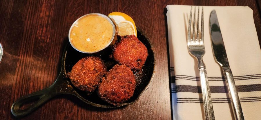 SOUTHERN SIDES. The Handsome Hog’s adaptation of Hush puppies include three deep fried balls of batter with crab stuffing and creole remoulade. See the menu at handsomehog.com or dine in at 173 Western Ave N, St Paul.