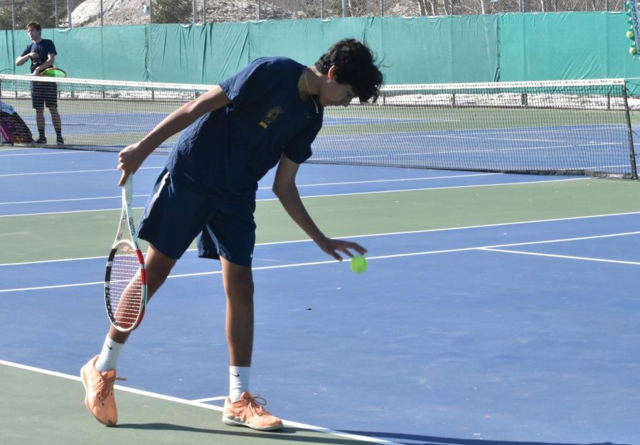 TRUST THE GAME. Junior Baasit Mahmood routinely bounces the tennis ball before staring down the court and then serving. Going into matches with a strong mindset is a must for him. “Trusting your shots [and] trusting your game is huge,” Mahmood said.