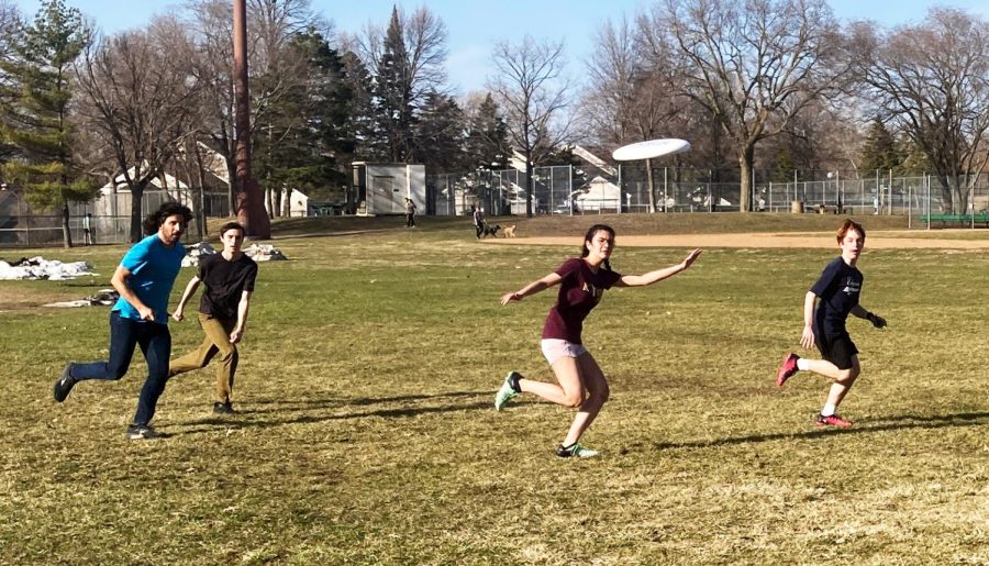 Who’s gonna get it? Four ultimate players chase after the frisbee. Spartan Ultimate practice was moved outside to Edgcumbe Rec Center Apr. 10, which allowed more space for the team to run free. “Official practice is at the Goodrich gym, which does not fit 30 people,” Theo Bonin, pictured far right, said.