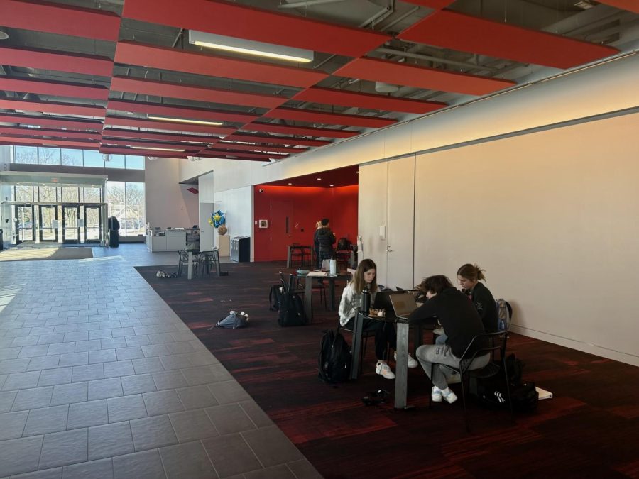 HALLWAYS OF HUSS. Many students gather in the large Red Wing Commons because of the aesthetic and variety of places to sit.