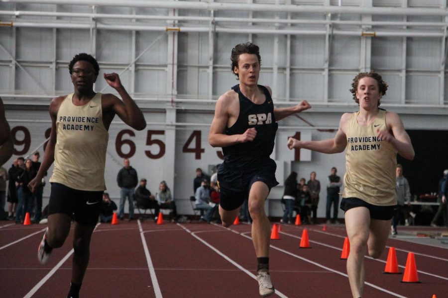 KEEP BREATHING. Sophomore Oliver Thompson uses every last breath and pump of his arms to make it across the finish line before his fellow runners.