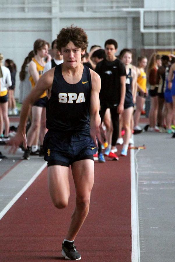 DRIVEN. Freshman Patrick Wall sprints forward down the Long Jump track with nothing but determination.
