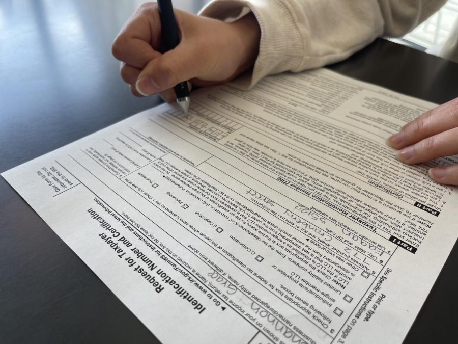 TAX TIME. Completing tax filings can be complicated and confusing, especially for high school students. Junior Rowan Hoffman said, “I had help from [my parents] with the payments [...].”