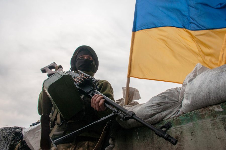 TENSIONS RISE. On Mar. 26, a Ukrainian soldier stands at the ready at a checkpoint near Kharkiv. A little over a year after the start of the Russia-Ukraine War, the conflict remains in full swing. 