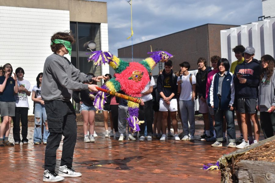 BLINDFOLDED. Junior Arden Lillemoe takes his turn to swing at the piñata.