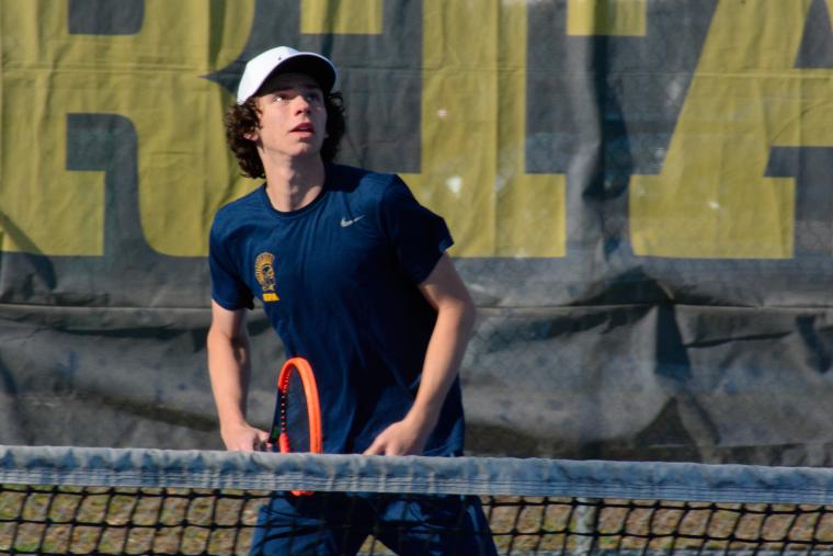 CHASE, PULL BACK, SWING. Junior Sandro Fusco tracks the trajectory of the ball before aiming a smash aim down the court.