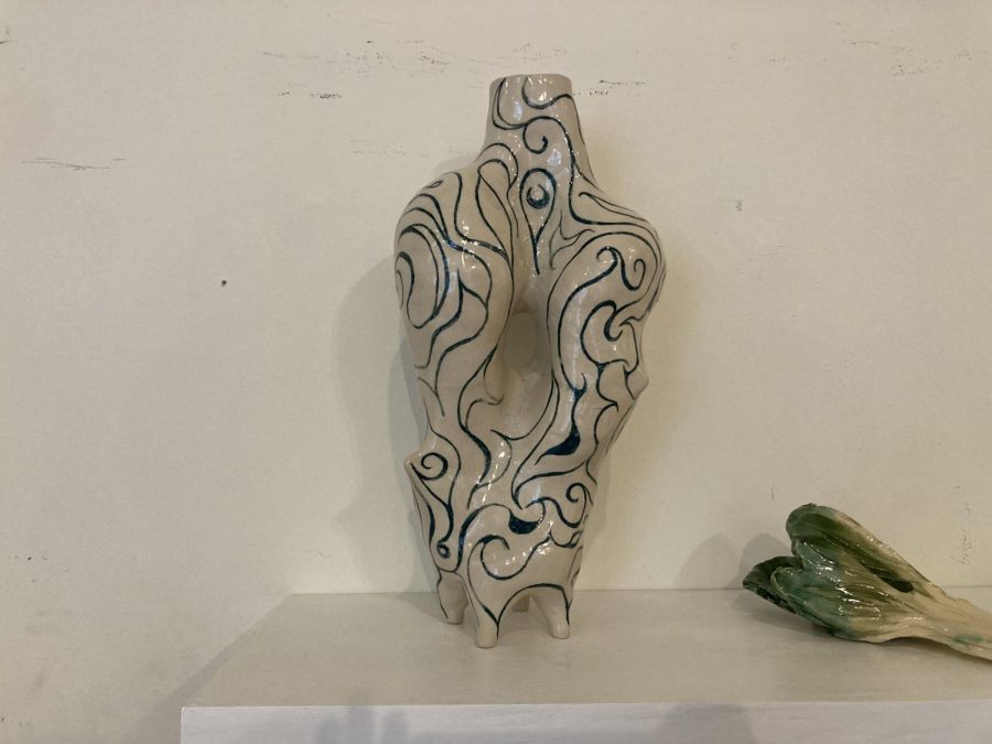 BLANCE. "Balance doesn't always feel steady" by Paola Evangelista shows a vase twisted but held upright. 