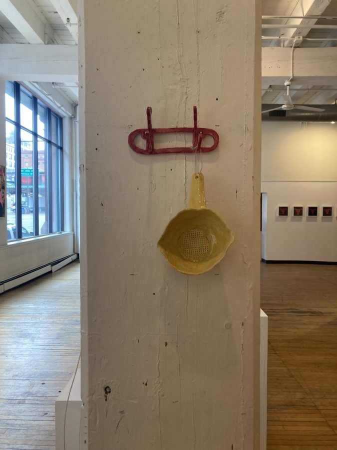 WALL ART. "Yellow Colander" by Anika Schneider depicts a colander from her kitchen and paintings. 