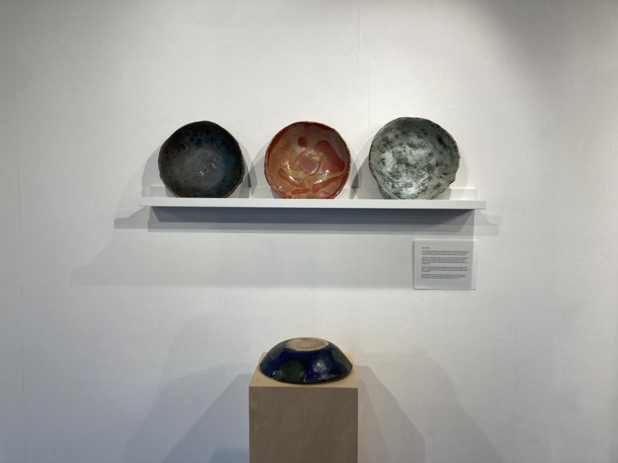 BOWLS ON DISPLAY. Mikkel Rawdon set up his ceramic bowls facing the crowd on a shelf.