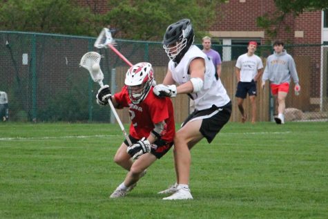 LOOK OUT. A Mound Westonka player struggles to stay on his feet with the Blackhawks defense applying pressure.