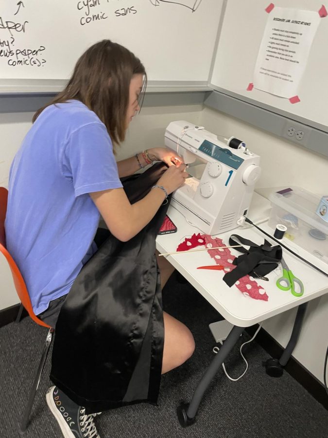 DO IT YOURSELF. Junior Violet Benson thrifted her black prom dress from Everyday People Clothing Exchange, a local secondhand clothing store. Finding the perfect dress was difficult in and of itself, but now Benson has taken on the project of altering the fabric on her own.