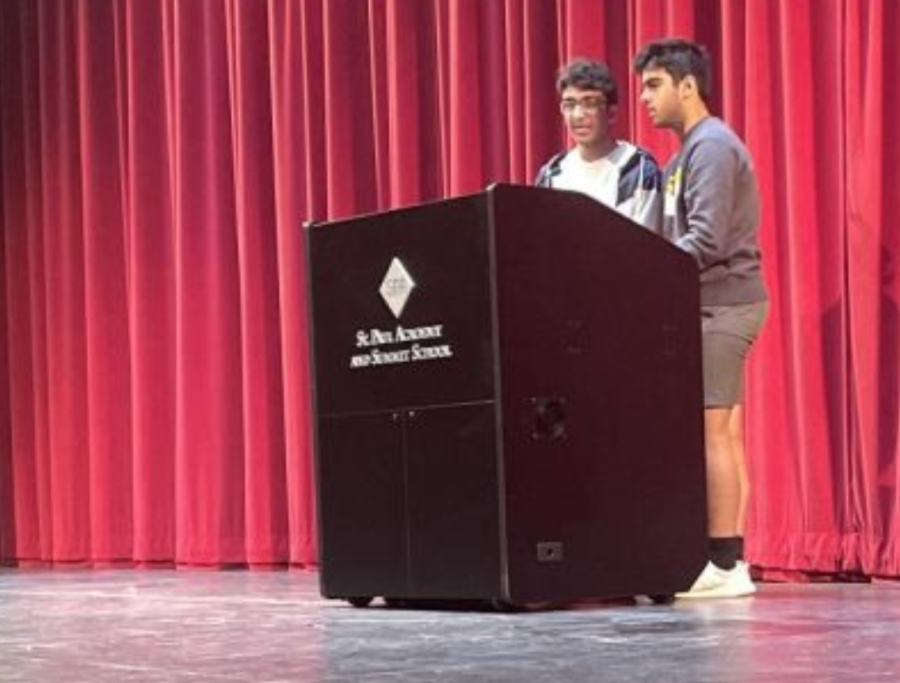 VOTE FOR ME. Rishi Bhargava and Humza Murad speak during X-Period assembly May 4 about their qualifications to become the new co-presidents of STC. A voting form was sent after assembly, and Bhargava and Murad will rise to the co-president position this month for next year.