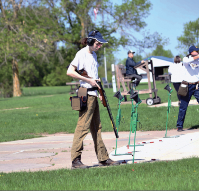 ONE IN THE CHAMBER. Captain Max Shaffer reloads his shotgun during a weekly practice. A normal round of trapshooting uses 25 shells.