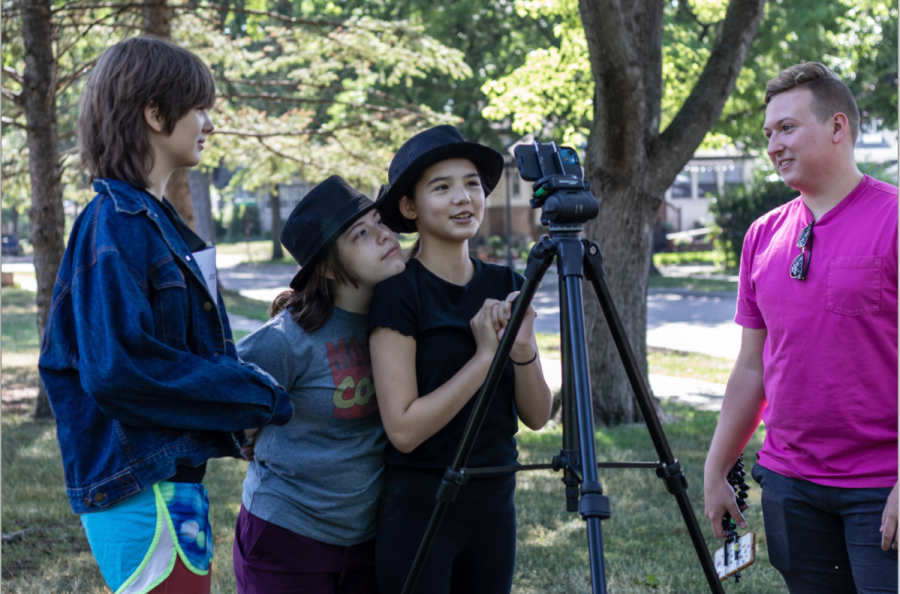 HELPING HAND. Film & Frolic counselor Andy Allen supervises three students as they film a movie. “[I’m] looking forward to another great three weeks this year,” he said. 