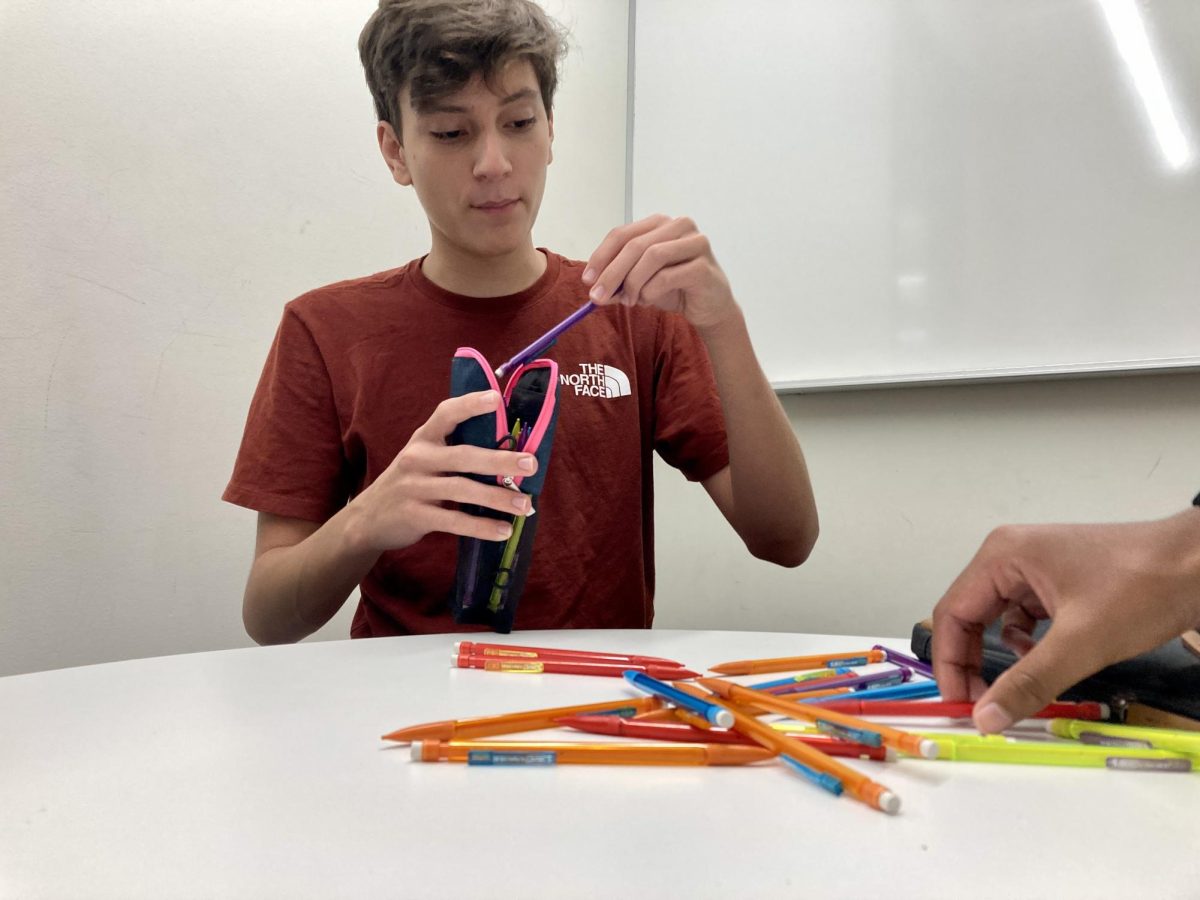 IN THE BAG. Malcolm Adams packs up his prized mechanical pencils. Mechanical pencils on top, he said. Malcolm spent the day gearing up for the year to come.