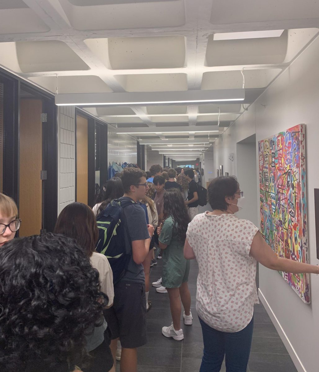 LUNCH RUSH. Students fill up the entire lunch hallway waiting to be let in for early lunch. This year, a 10 minute break period was implemented between period 2 and early lunch causing this line.