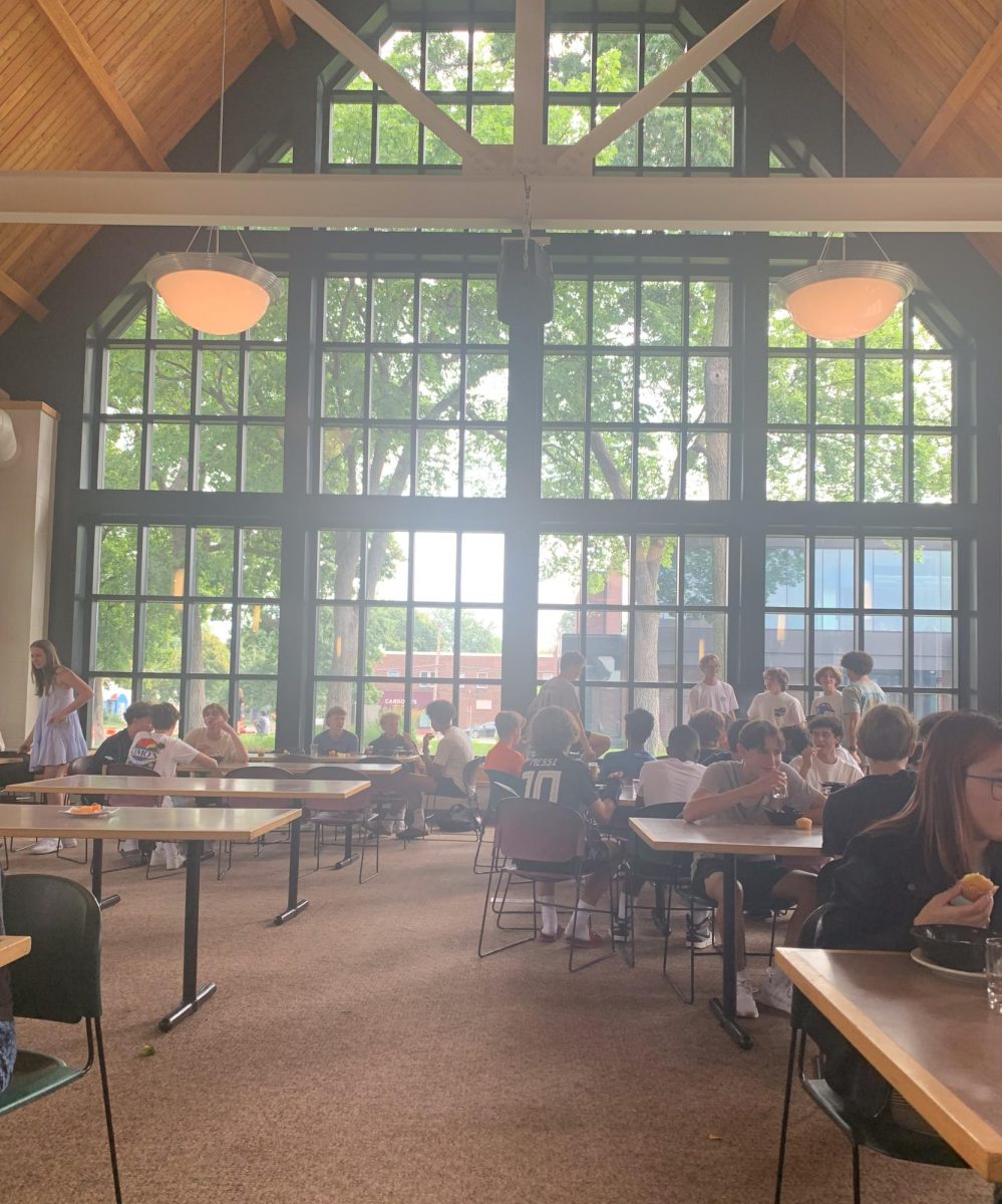 SOCIAL HOUR. All the students in the lunchroom create a buzzing atmosphere. In the cafeteria, people are chatting about their summers to their friends and talking about their next classes. 