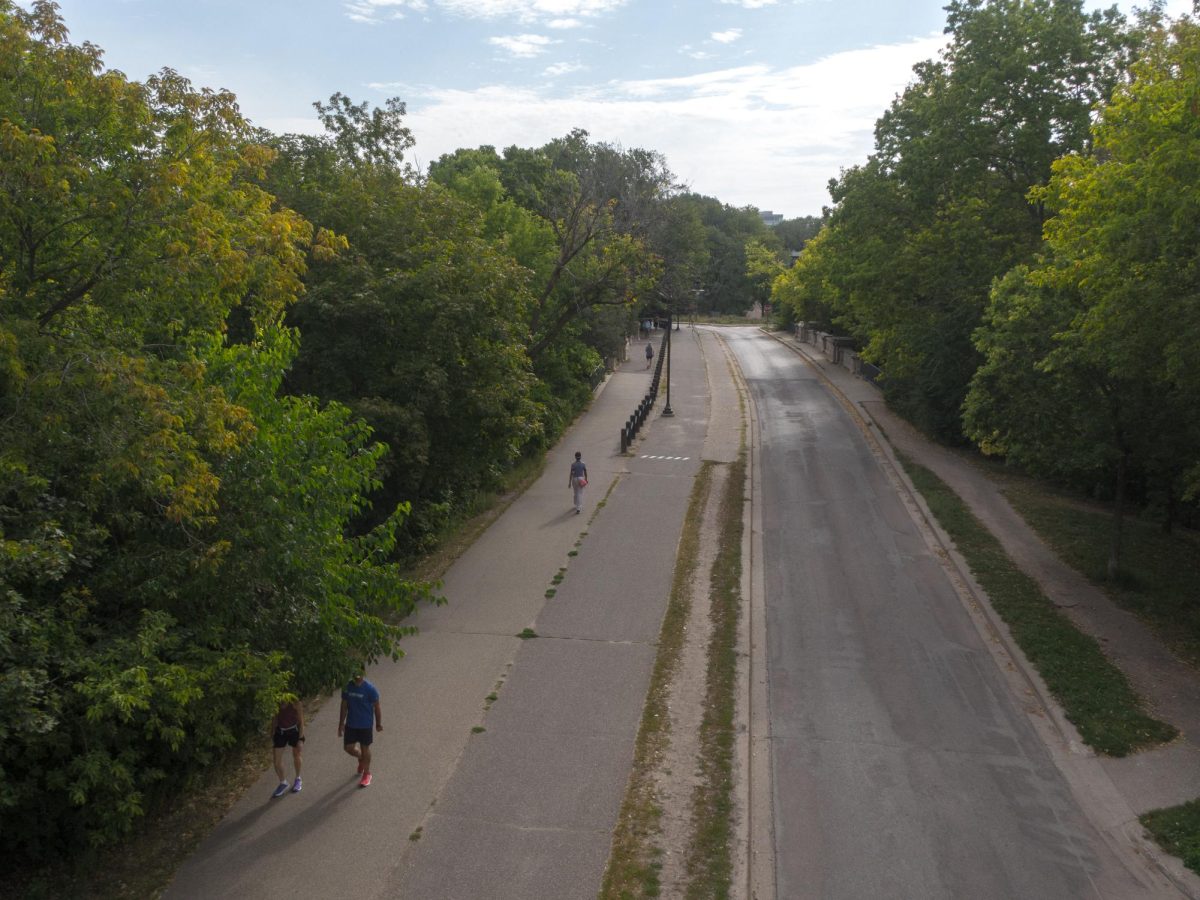 ROUND THE LAKES. Biking on the Grand Rounds in Minneapolis is a nice way to experience the citys alluring parks and lakes. This picture is taken at Lake of The Isles. All of the lakes are connected by bike/walking path