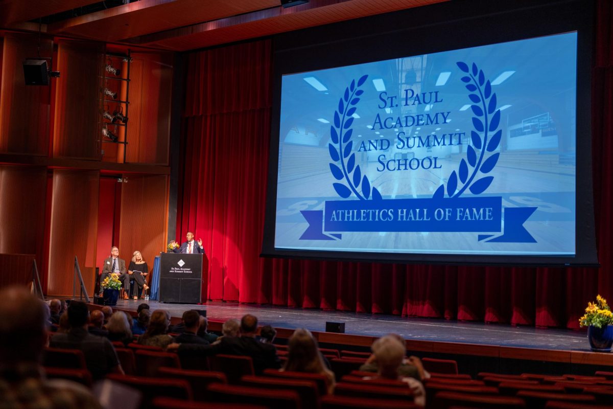 CELEBRATING SUCCESS. Head of School Luis Ottley opens the second-annual ceremony in the Huss Auditorium with a few words. The induction of alumni to the Athletic Hall of Fame took place Sept. 8. The final inductee was Manuel Lagos, “A lot of us wouldn’t be here if it weren’t for Buzz,” Sanneh said.