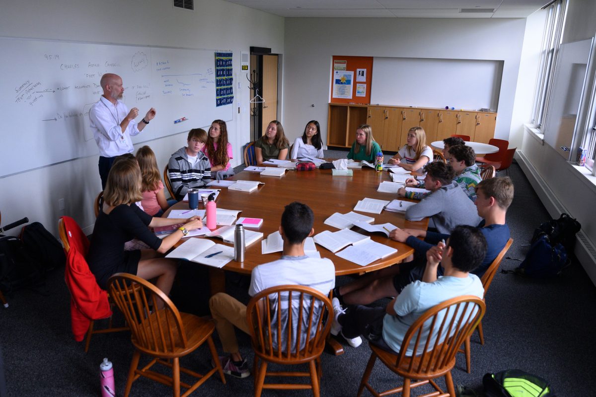 History teacher Ben Bollinger Danielson teaches around a Harkness table in 2020, the last time they were in classrooms before this year.